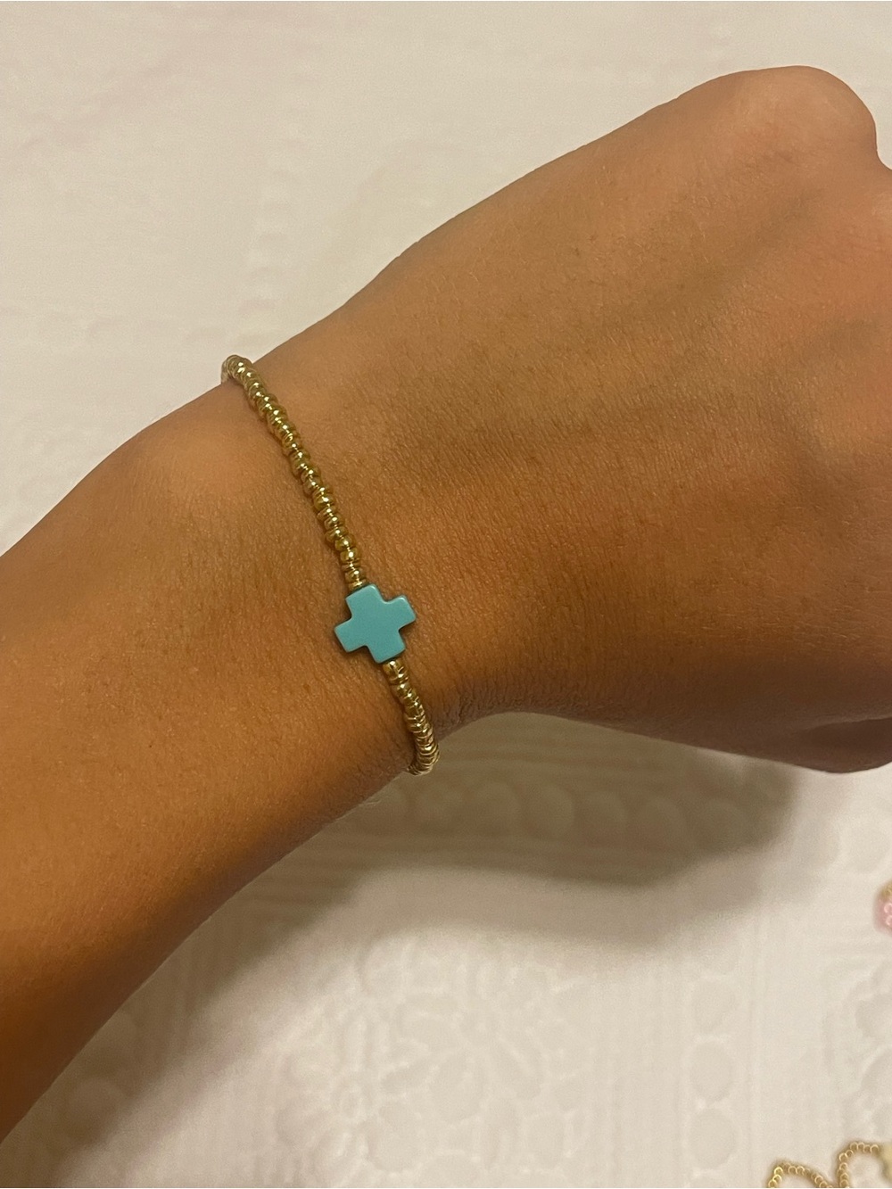 SET OF 3 gold, pearl, blue bracelet with a enewton cross.